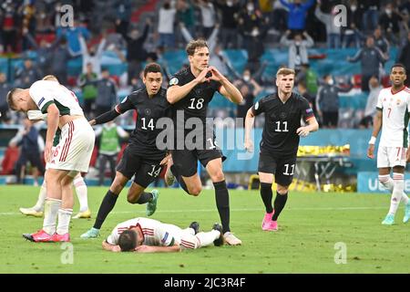 Preview of the UEFA Nations League game Hungary-Germany: goaljubel Leon GORETZKA (GER) after his goal to 2:2, left to right Willi ORBAN (HUN), Jamal MUSIALA (GER), Leon GORETZKA (GER), Timo WERNER (GER), shapes a heart, gesture, gesture, jubilation, joy, excitement, action. Group phase, preliminary round group F, game M36, Germany (GER) - Hungary (HUN) 2-2, on June 23rd, 2021 in Munich/Germany, football arena (Alliianz Arena). Football EM 2020 from 06/11/2021-07/11/2021. Stock Photo