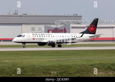 An Air Canada Express (Jazz Aviation) Embraer 170-200 taking off from Montreal Pierre Elliott Trudeau international Airport. Jazz Aviation is a Canadian regional airline based at Halifax Stanfield International Airport Stock Photo