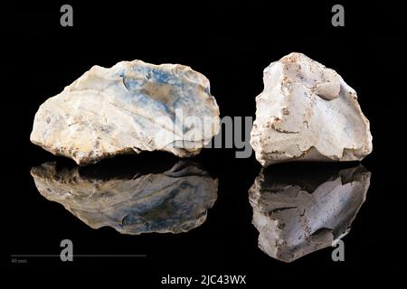 Stone tools on black background. Stock Photo