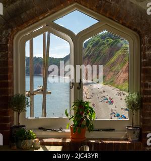 Jacobs Ladder Beach Sidmouth, looking through a window at the Clock Tower, Devon, England Stock Photo