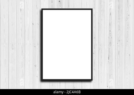 Picture frame on a white wooden wall white frame. Blank Mockup . Stock Photo