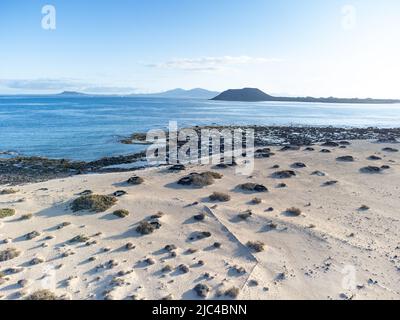 Corralejo Sand Dunes bay with views to Lobos Island aerial shot, Fuerteventura Stock Photo