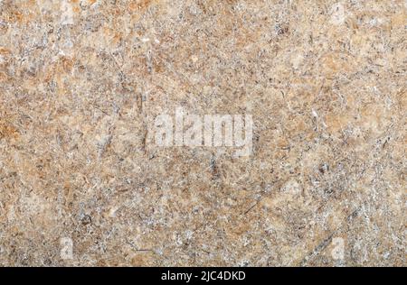 Background of beige and brown abstract pattern of stone granite slab in high resolution. Stock Photo