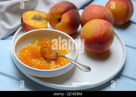 Peach jam in shell and peach tree (Prunus persica) Stock Photo