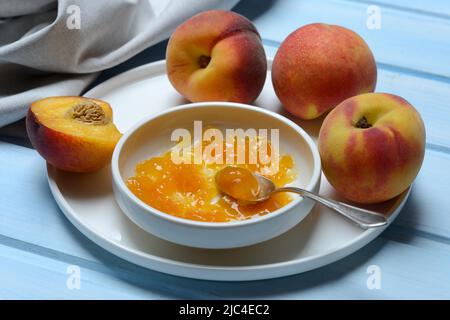 Peach jam in shell and peach tree (Prunus persica) Stock Photo