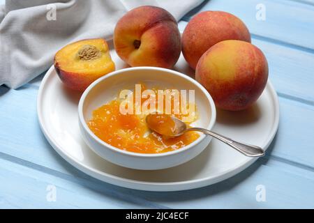 Peach jam in shell and peach tree (Prunus persica) Stock Photo