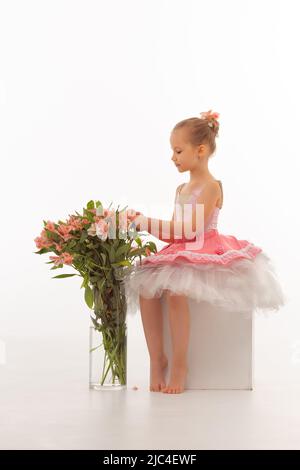 Girl ballerina in a tutu with flowers Stock Photo