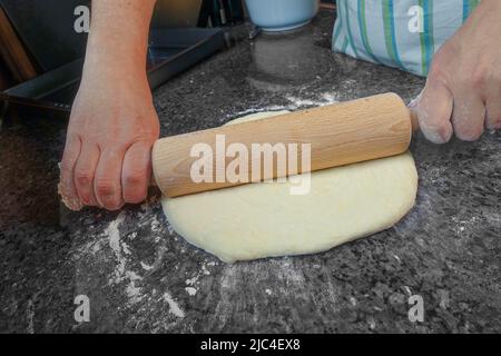 Swabian cuisine, preparation of Kirchweihkuchen, Swabian baking speciality, from the oven, baked, sweet cake, covered apple pie, apple sauce slices Stock Photo