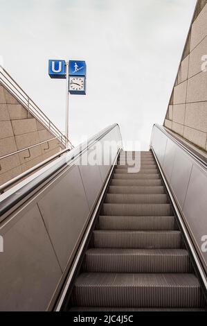 Underground, staircase, escalator, signs, clock, Munich, Bavaria, Germany Stock Photo