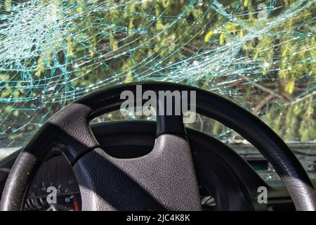 Abandoned car on the roadside forest after accident Stock Photo