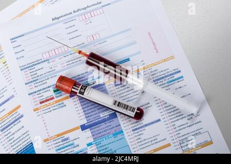 blood probe and request form for analysis in a laboratory Stock Photo