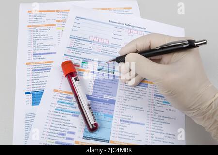 blood probe and request form for analysis in a laboratory Stock Photo