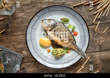 Top view on plate of grilled gourmet fish Stock Photo