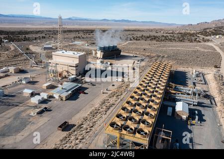 Heat exchangers for the binary geothermal system at the Blundell Geothermal Plant in Utah.  At left are the cooling towers of the single-flash unit at Stock Photo