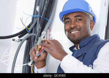 happy electrician technician at work Stock Photo