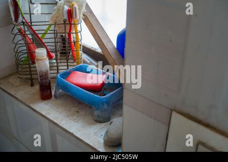 Toiletries, A close-up shot of soap, shampoo, toothpaste, etc in an Indian middle-class household bathroom. Stock Photo