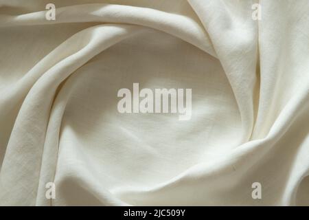 White crumpled linen fabric texture background. Natural linen organic eco textiles canvas background. Top view Stock Photo