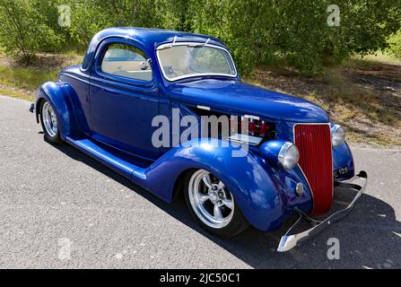 Three-quarters front view of a Hot Rod, based on a 1936, Ford Coupe,  on display at the Deal Classic Car Show 2022 Stock Photo
