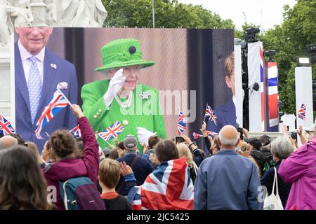 5th June 2022 - Crowds watching Queen Elizabeth's Buckingham Palace balcony appearance at her Platinum Jubilee celebration on the Mall in London, UK Stock Photo
