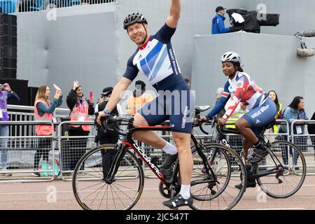 5th June 2022 - Olympians Sir Chris Hoy and Kadeena Cox ride along the Mall in London during Queen Elizabeth's Platinum Jubilee Pageant Stock Photo