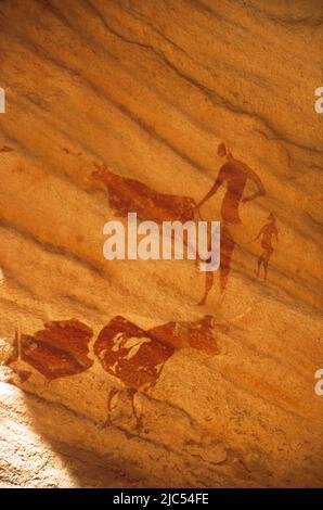 Neolithic rock painting of pastoral scene, Bovidian period, c. 6,500 years BP, Tassili N'Ajjer, Sahara desert, South Algeria Stock Photo