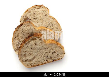 three slices wheat bread isolated on white background, fresh bread with seeds and linen, top view Stock Photo