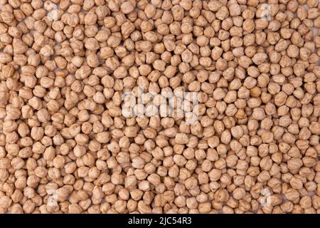 chickpea background, healthy vegetarian food concept, pile of uncooked chickpeas, top view Stock Photo