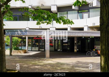 Entrance to Uni-Center Cologne, one of the largest residential buildings in Europe. Cologne, North Rhine-Westphalia, Germany, 22.5.22 Stock Photo
