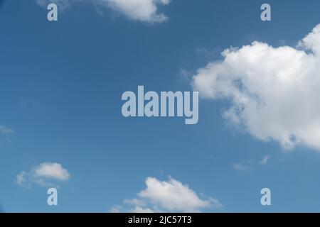 Blue sky with scattered white clouds during the day Stock Photo