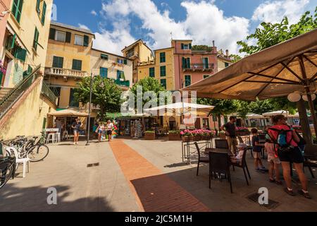 Small square in downtown of Monterosso al Mare village with restaurants and shops. Cinque Terre National park in Liguria, La Spezia, Italy, Europe. Stock Photo