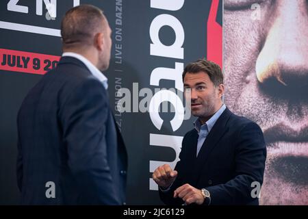 LONDON, UNITED KINGDOM. 10th Jun, 2022. Promoter Eddie Hearn looks on at Kubrat Pulev of Bulgaria during Matchroomboxing Presents Chisora vs. Pulev 2 Press Conference at Canary Riverside Plaza Hotel on Friday, June 10, 2022 in LONDON (Editorial use only, license required for commercial use. No use in betting, games or a single club/league/player publications.) Credit: Taka G Wu/Alamy Live News Stock Photo