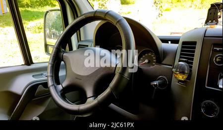 Close-up of the dashboard, speedometer, tachometer and steering wheel. Modern car interior. Internal cabin. Vehicle interior. Close shot of car dashbo Stock Photo