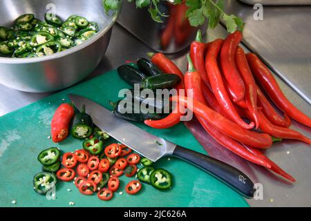Chillies in a restaurant kitchen. Stock Photo