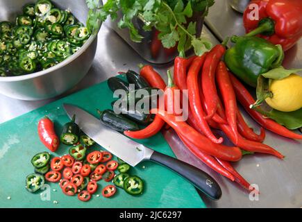 Chillies in a restaurant kitchen. Stock Photo
