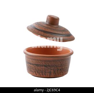 Brown ceramic cooking kitchen pot pan with an open cover opened isolated on white.Kitchenware. Stock Photo