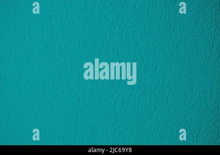 Green color cement wall background for texture design. Abstract turquoise plaster surface. Stock Photo