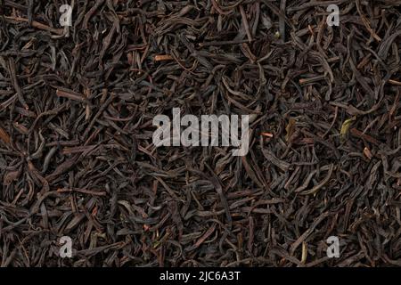 Dried Ceylon blend tea leaves full frame close up as background Stock Photo