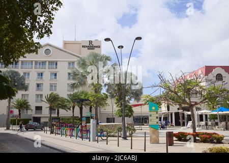 ORANJESTAD, ARUBA - DECEMBER 4, 2021: Plaza Daniel Leo square with Renaissance Resort Hotel, Renaissance Mall and Green Bike rental station on Aruba Stock Photo