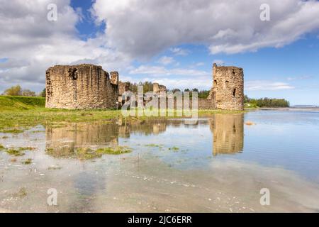 Flint castle at high spring tide, North Wales coast Stock Photo