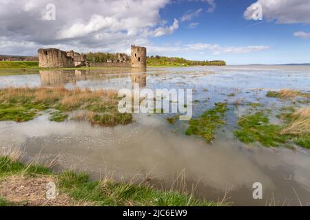 Flint castle at high spring tide, North Wales coast Stock Photo