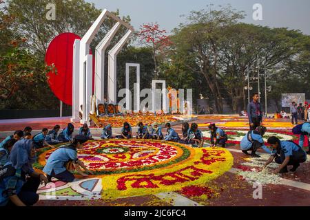 Volunteers busy decorating the Central Shaheed Minar with flowers on 21st February to honor the martyrs of the Language Movement. Dhaka, Bangladesh. Stock Photo
