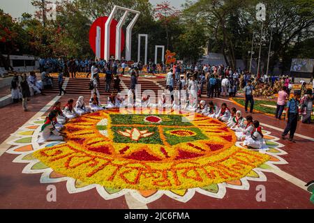 Volunteers busy decorating the Central Shaheed Minar with flowers on 21st February to honor the martyrs of the Language Movement. Dhaka, Bangladesh. Stock Photo