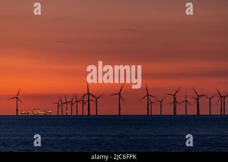 Gwynt-y-Môr offshore wind farm at dusk, Colwyn Bay, North Wales Stock Photo