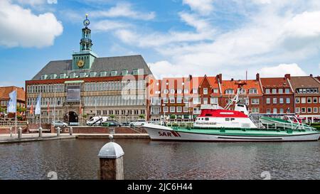 Emden, Lower Saxony, Germany - 19 June 2021: Inland harbor Ratsdelft in Emden with the historic town hall Stock Photo