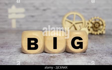 Big deal symbol. Concept words 'big deal' on wooden cubes and block on a beautiful grey background, copy space. Business and big deal concept. Stock Photo