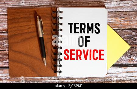 Term of service text concept write on notebook. Stock Photo