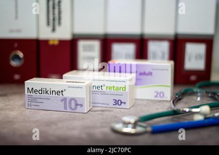 A Drug box of  Medikinet  containing Methylphenidate  for treatment of   attention deficit hyperactivity disorder' (ADHD), on a table and in the backg Stock Photo