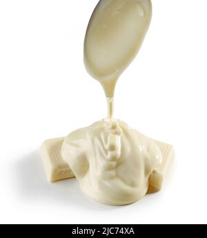 pouring melted white chocolate isolated on white background Stock Photo
