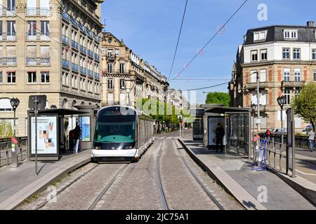 Strasbourg, France - April 2002: Modern electric tram at a tram stop in the city centre. The city has an extensive tram network. Stock Photo