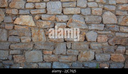 Stone wall textured. Front view. Stock Photo